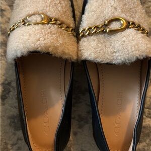 Coach Black Leather Loafers with Cream Shearling and Gold Chain